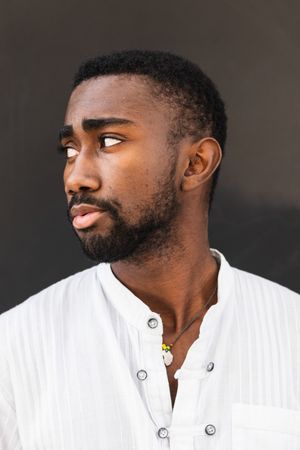 Black man in trendy clothes in city