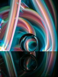 Crystal ball on board near abstract shines