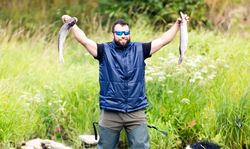 Fisherman celebrating big catch
