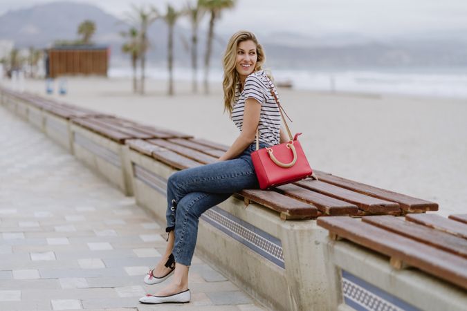 Young woman sitting on bench
