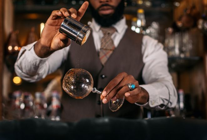 Stylish cocktails: a professional bartender in action