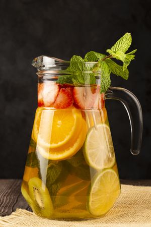 Water flavored with fresh summer fruit.