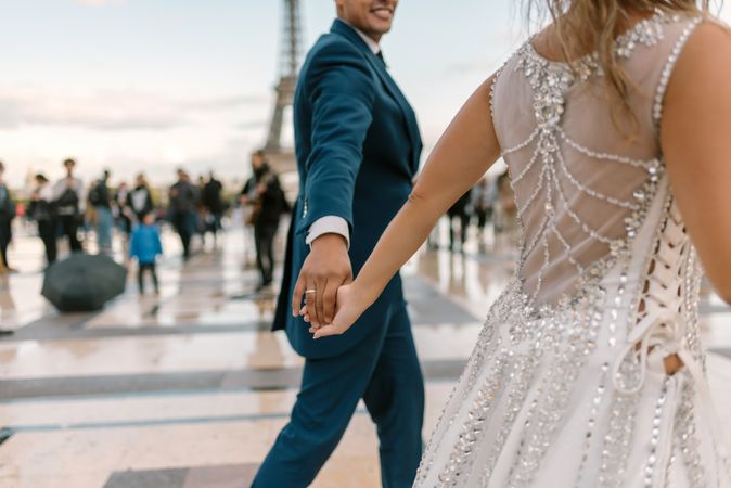 Happy newlyweds in wedding clothing dancing together