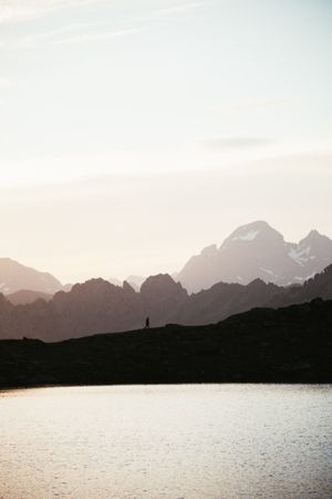 Majestic mountain landscape with human silhouette