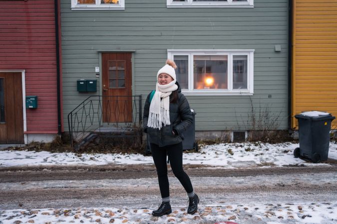Cheerful female against northern house