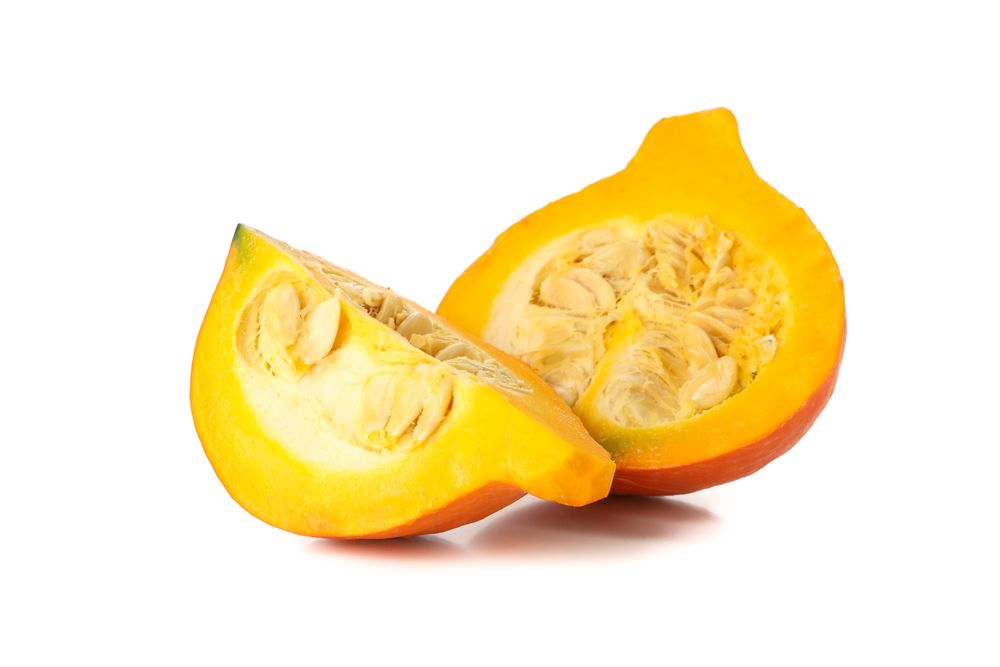 Half of pumpkin and slice isolated on blank background
