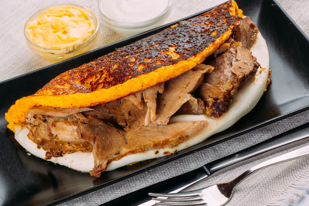 Cachapa, typical Venezuelan dish made with corn and stuffed with cheese and pork
