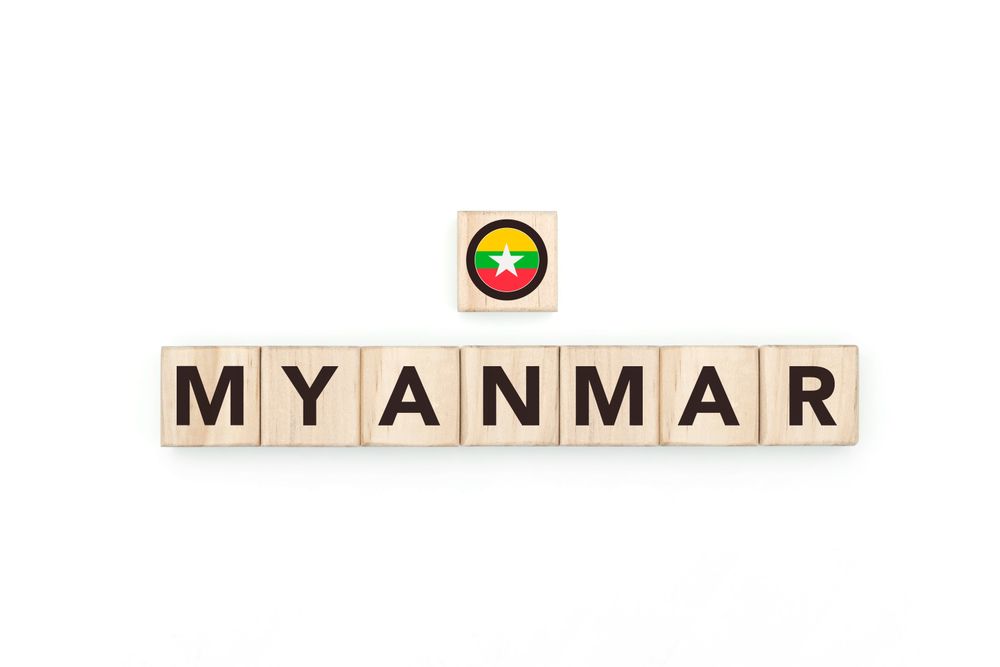 Wooden blocks bearing the name and flag of Myanmar.