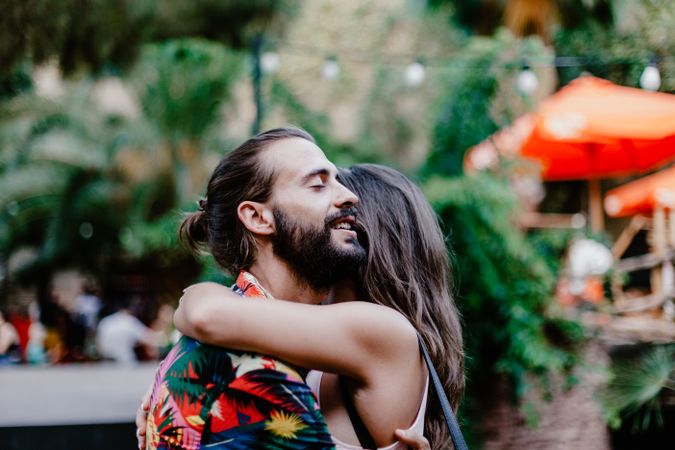 Embracing couple on street laughing