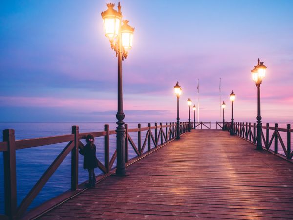 back view of anonymous girl on pier