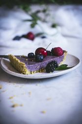 Blueberry pistachio sliced cake with whole berries on top