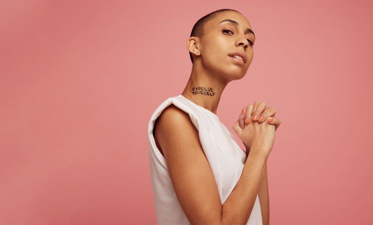 Confident female with express yourself written on her neck