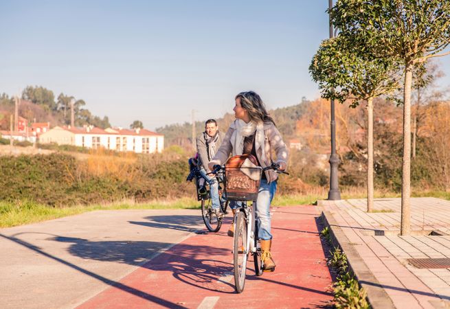 Woman looking around at man on bike ride together
