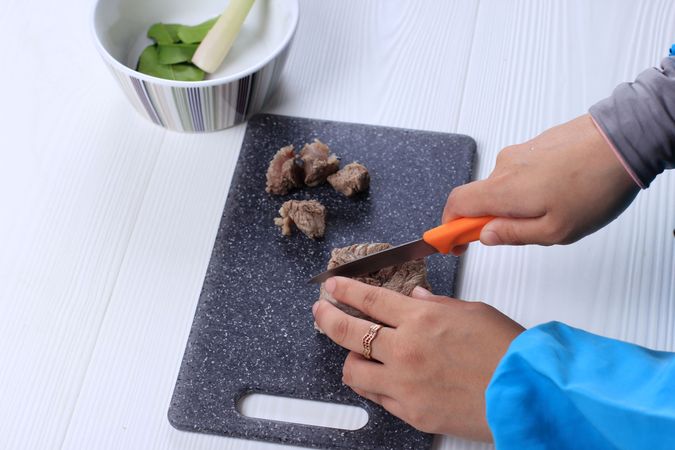 Cutting Beef in to Cube Preparing Idul Adha or Ied Al Adha Cuisine
