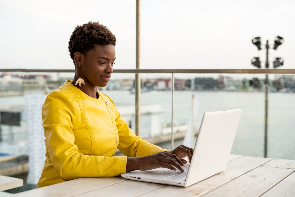 Female working on laptop at table