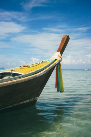 Floating boat in peaceful clear water