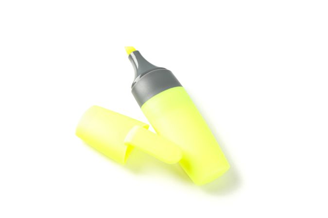 Color office highlighter isolated on plain background