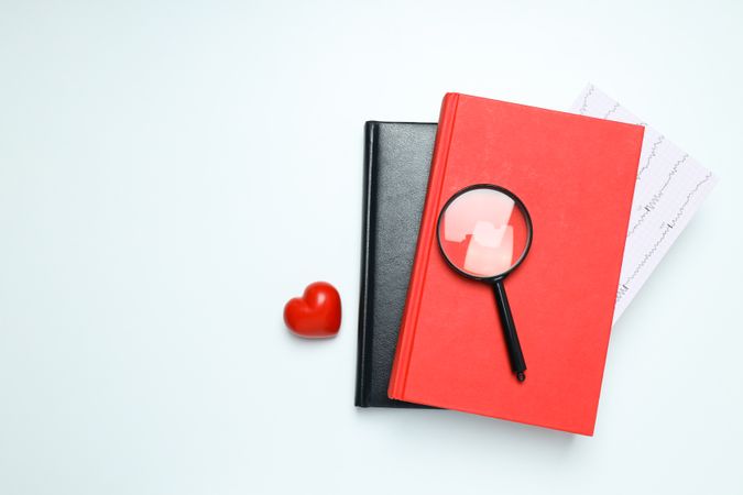 Medical literature - books and doctors accessories on light background