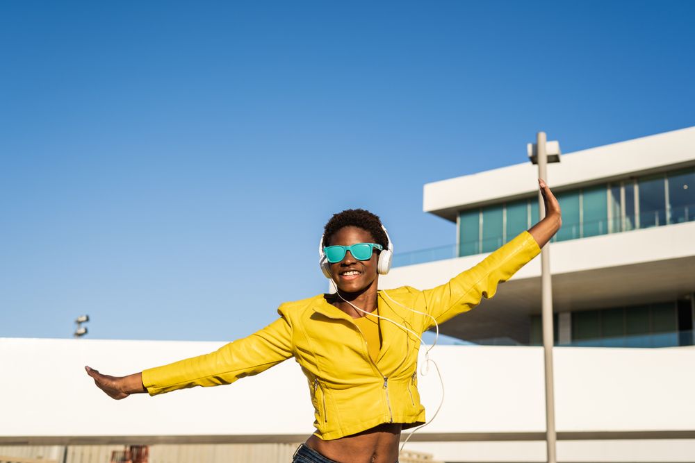 Joyful female smiling and jumping