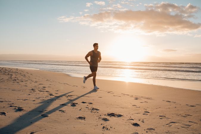 Young man on morning run outdoors