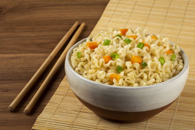 Bowl with instant noodles on the table.