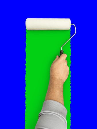 Male Hand Rolling Paint Roller Over Blue and Green Screen Background.