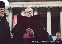 London, England, United Kingdom - March 5 2022: Catholic bishop doing a reading at a protest 0PyOl5