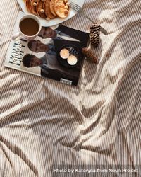 Mini pancakes and coffee on a duvet with magazine 4Ne8l5