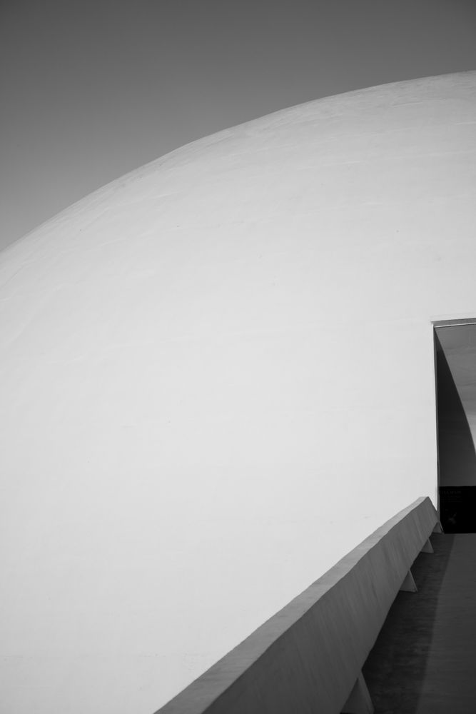 Grayscale photo of wall beside a door