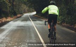 Cyclist practising on a rainy day 0KMVPV