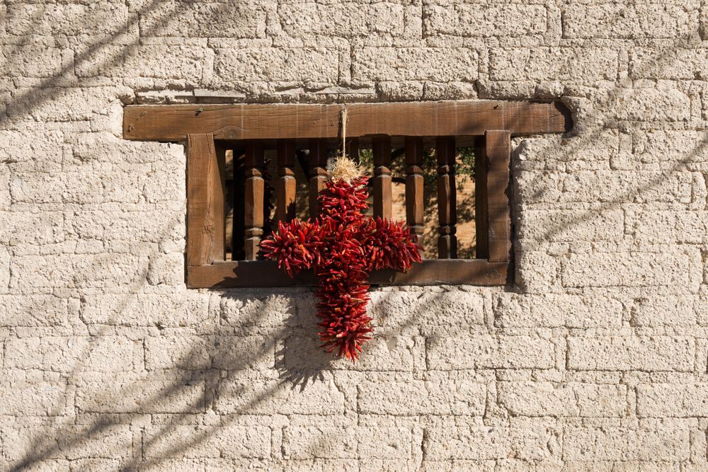 Dried pepper cross hangs in window of the Gage Hotel in Marathon, Texas