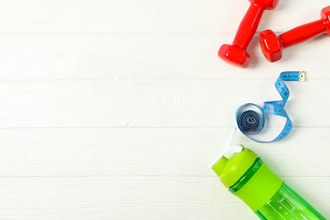 Flat lay composition with loss weigh accessories on plain wooden background