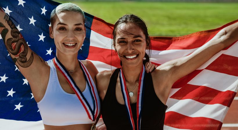 Two US athletes with national flag