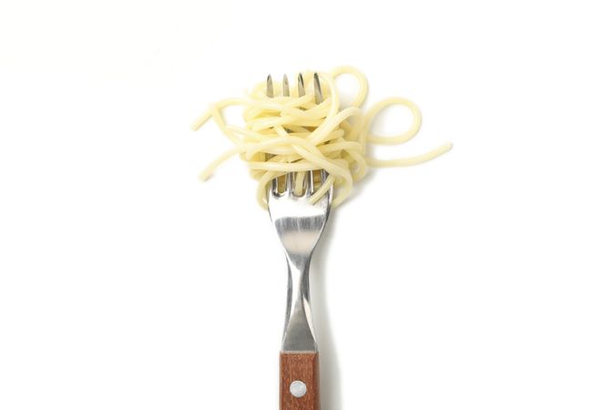 Fork with tasty pasta isolated on blank background
