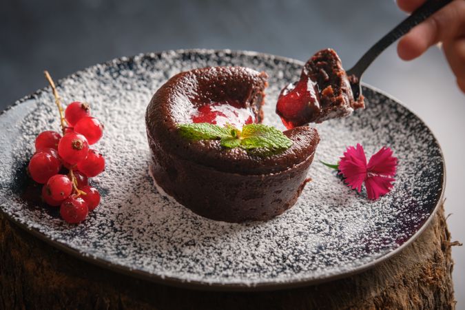 Anonymous person trying berry lava cake