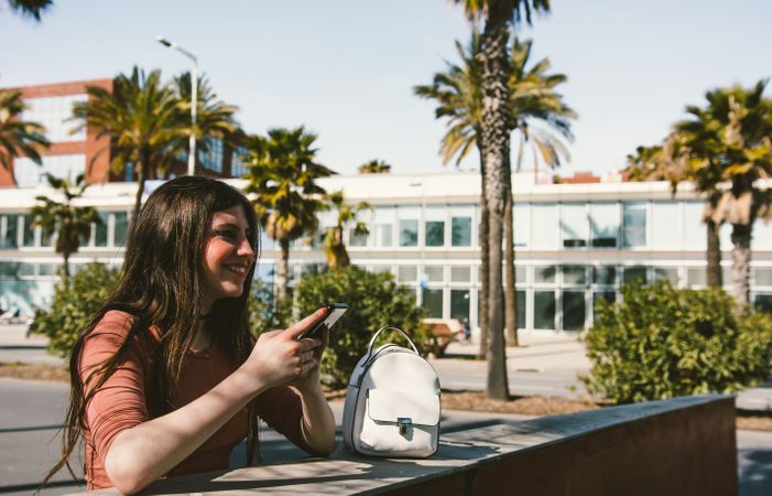 Teen girl looking at her smartphone.