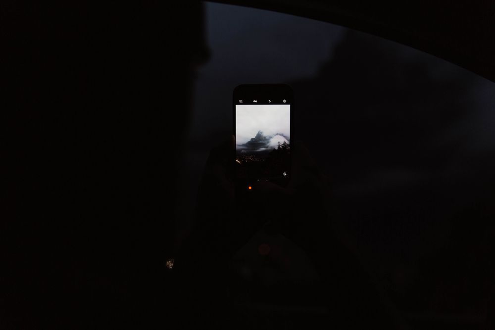 Powerful mountains and cloudy sky view from window of car