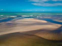 View out to the horizon of Brazilian beach at low tide