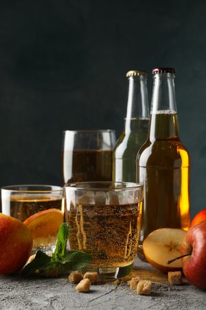 Composition with cider, sugar and apples on gray background