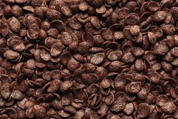 Chocolate cornflakes cereal, background, top view