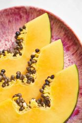 Fresh slices of papaya on plate
