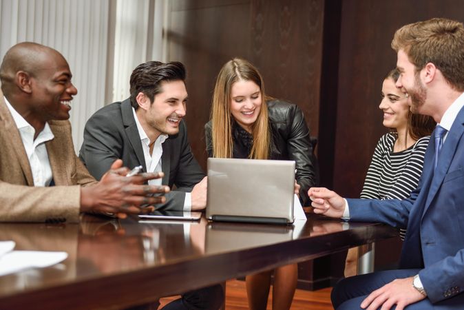 Woman leading her colleagues in a brain storming meeting at work