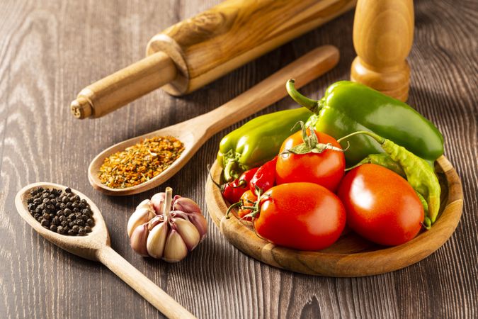 Wooden table with ingredients for pizza.