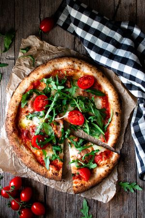 Appetizing pizza placed on wooden table