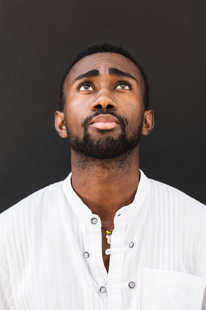 Black man in trendy clothes in city
