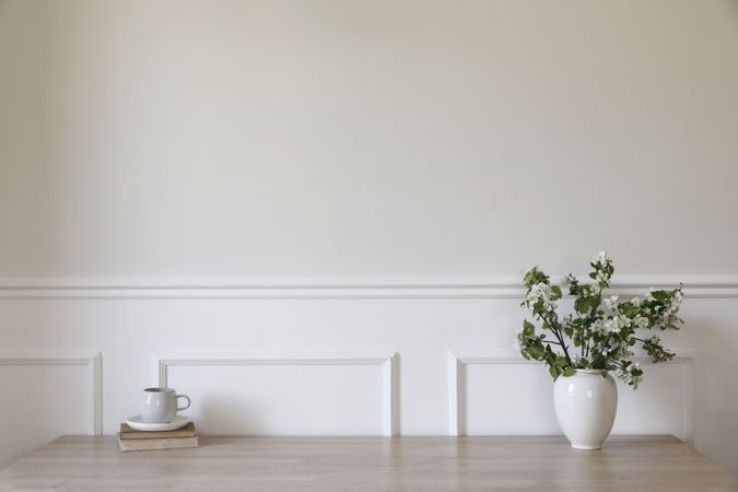Ceramic vase with blooming apple tree branches