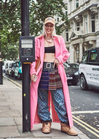 London, England, United Kingdom - September 18 2021: Blonde woman in multi pattern outfit