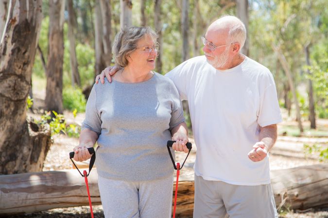 Happy Mature Couple Exercising Outside Together