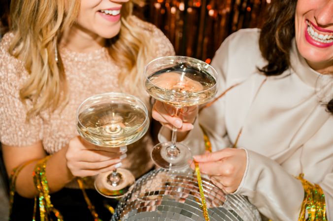 Close Up of cheerful woman at Party Making Champagne Toast Together