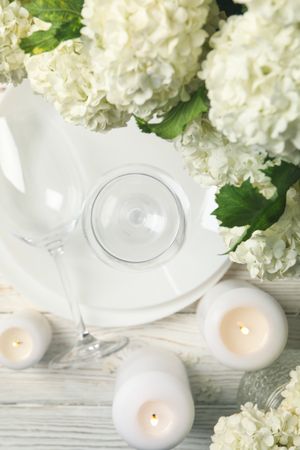 Composition with hydrangea flowers on wooden background, top view. Romantic evening